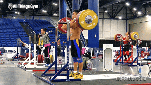 Olympic weightlifter performing a heavy front squat for clean and jerk strength